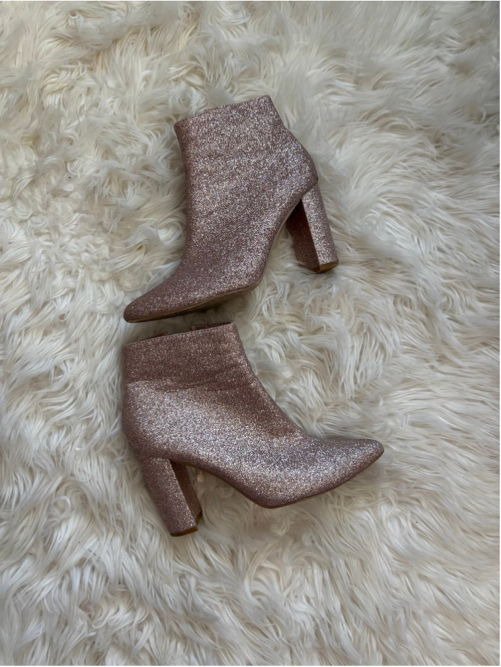 Well worn pink woman's sparkle boot ankle heels